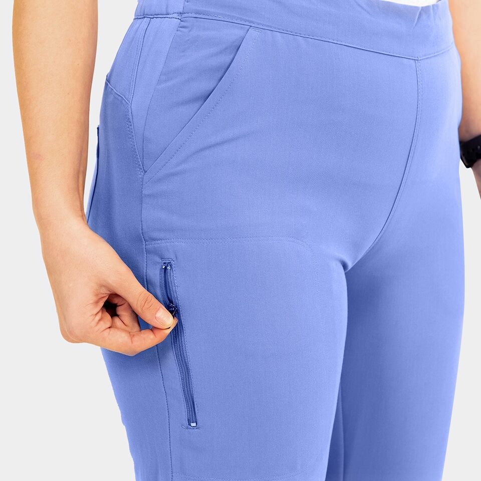 Elite-by-IRG_3852-WomensSportyDoubleV-NeckTop-7801-WomensHalfKnitTaperedLegPant-3811-WomensSidePocketJacket-CeilBlue-CBL-06-IRG-Scrubs-1-1.jpg