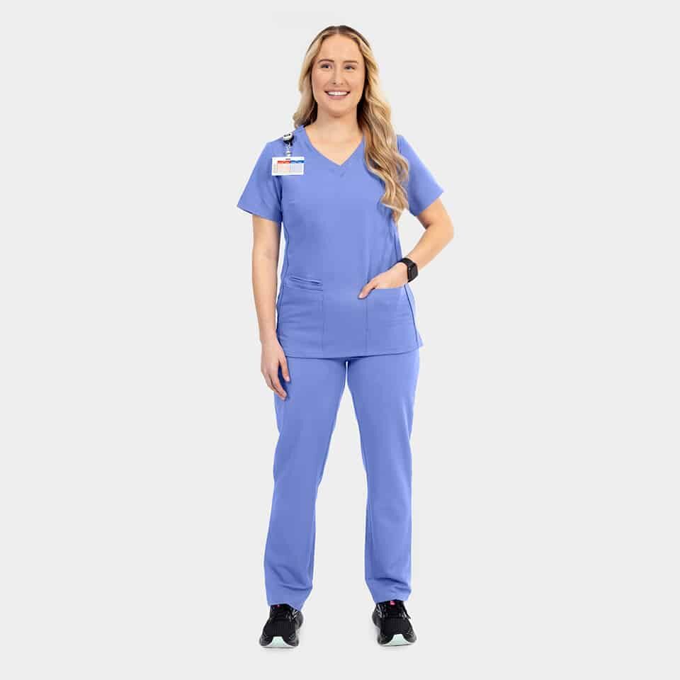 Elite-by-IRG_3852-WomensSportyDoubleV-NeckTop-7801-WomensHalfKnitTaperedLegPant-3811-WomensSidePocketJacket-CeilBlue-CBL-07-IRG-Scrubs-.jpg