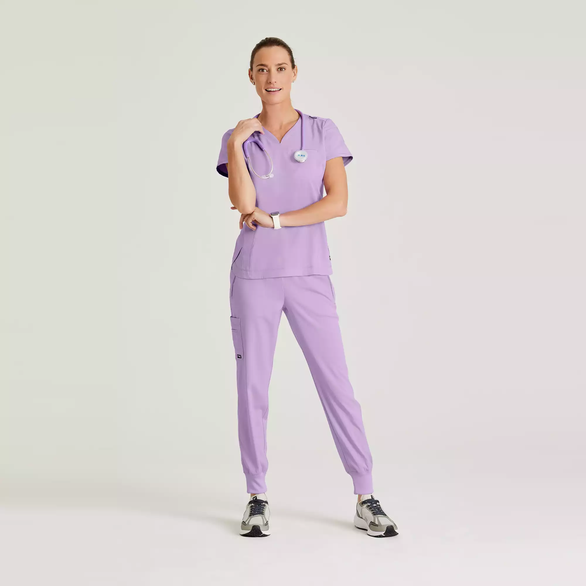 Greys-Anatomy-Spandex-Stretch-Womens-2-Pocket-V-Neck-Tuck-In-Top-GRST136-Purple-Freesia-02.webp Greys Anatomy Spandex Stretch Womens 2 Pocket V Neck Tuck In Top GRST136 Purple Freesia 02