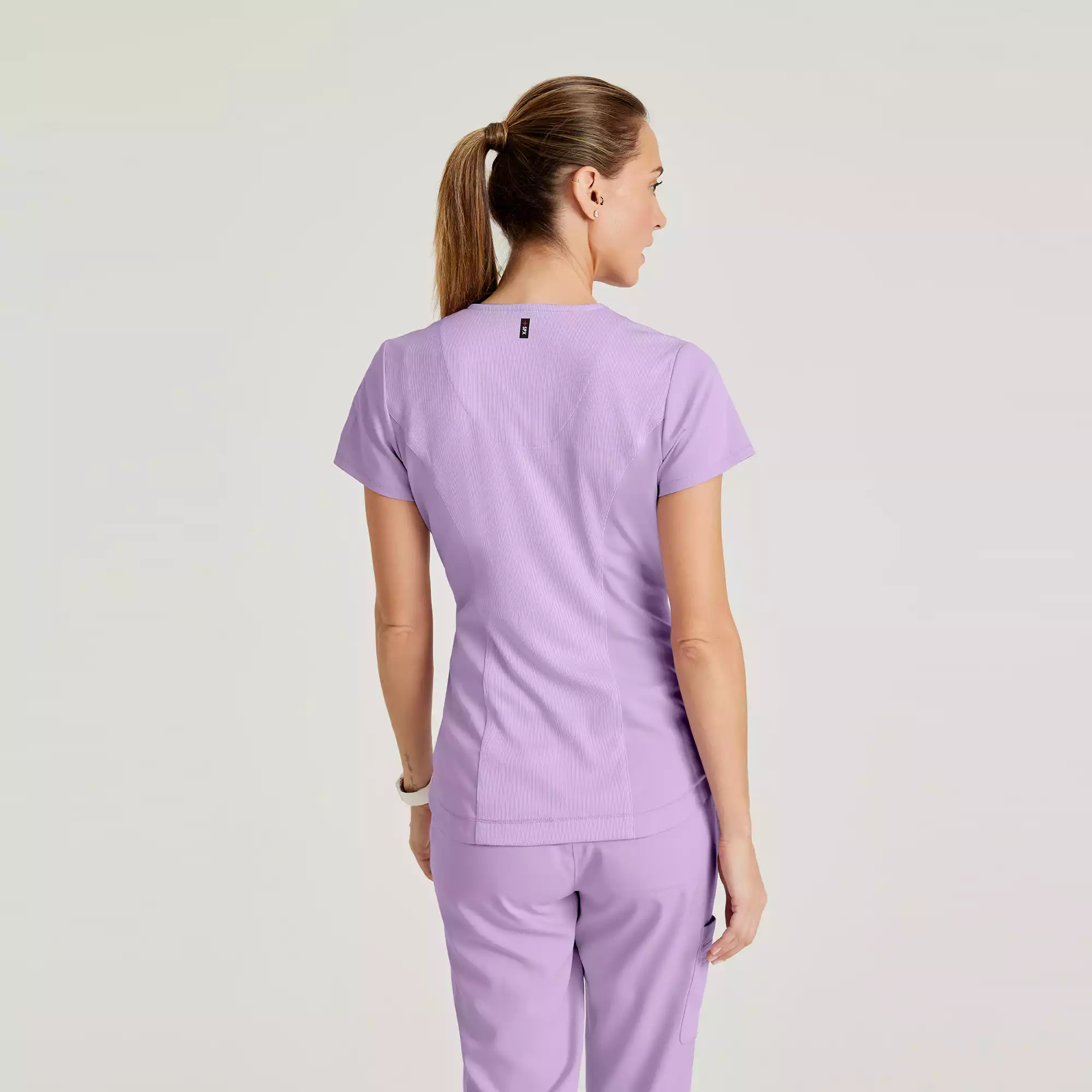 Greys-Anatomy-Spandex-Stretch-Womens-2-Pocket-V-Neck-Tuck-In-Top-GRST136-Purple-Freesia-04.webp Greys Anatomy Spandex Stretch Womens 2 Pocket V Neck Tuck In Top GRST136 Purple Freesia 04