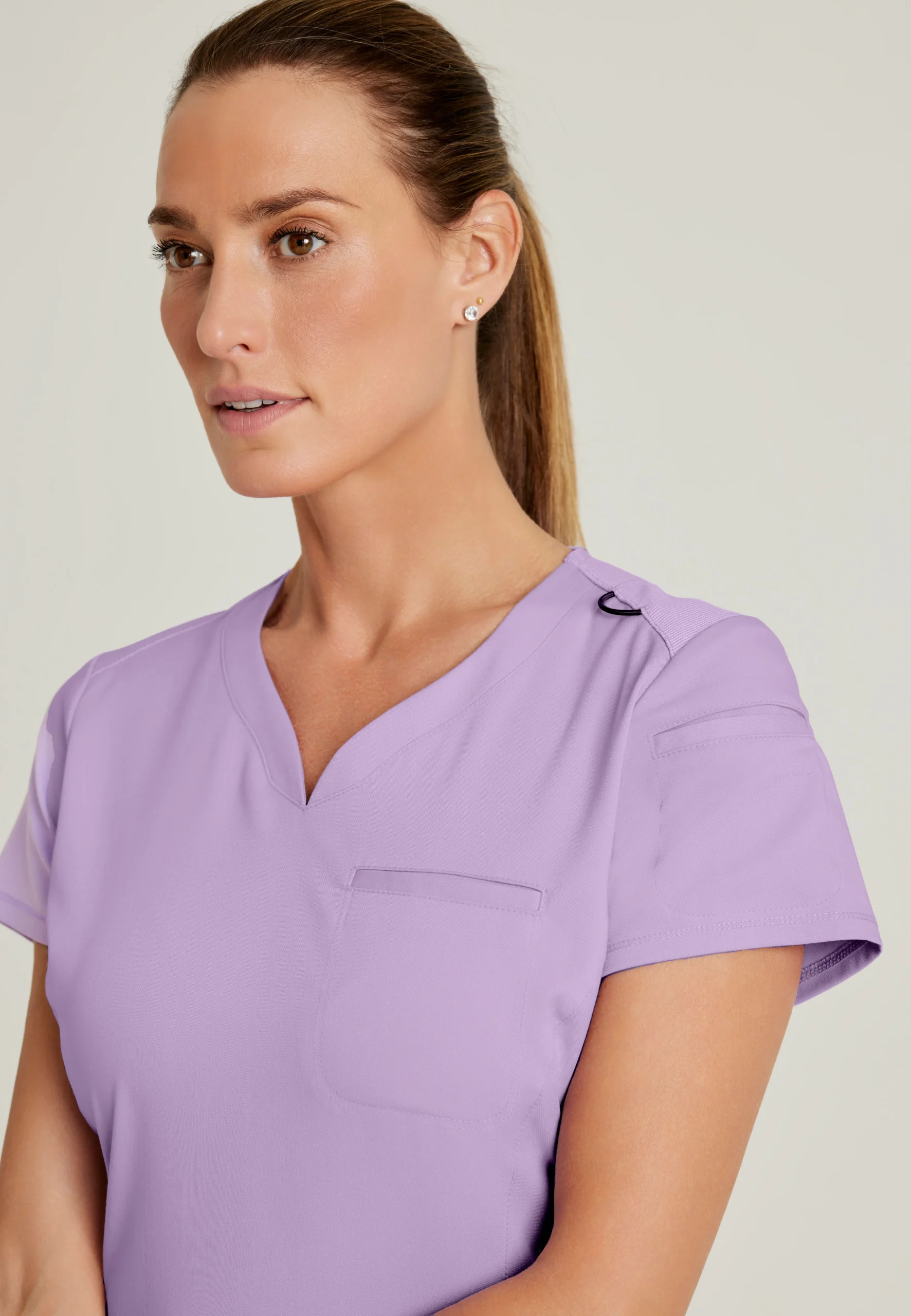 Greys-Anatomy-Spandex-Stretch-Womens-2-Pocket-V-Neck-Tuck-In-Top-GRST136-Purple-Freesia-05-1-scaled-1.webp Greys Anatomy Spandex Stretch Womens 2 Pocket V Neck Tuck In Top GRST136 Purple Freesia 05 1 scaled 1
